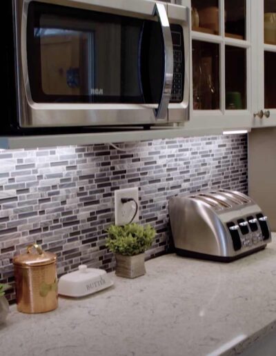 Simple granite straight kitchen style with built-in microwave oven